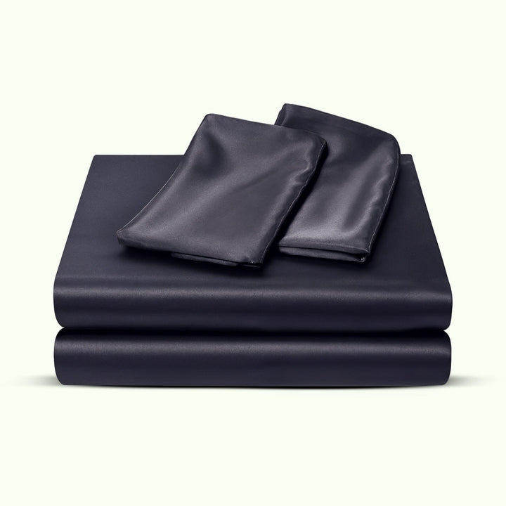 "Luxurious full size satin sheets with deep pockets, silky sheen in elegant colors, draped beautifully on a bed."