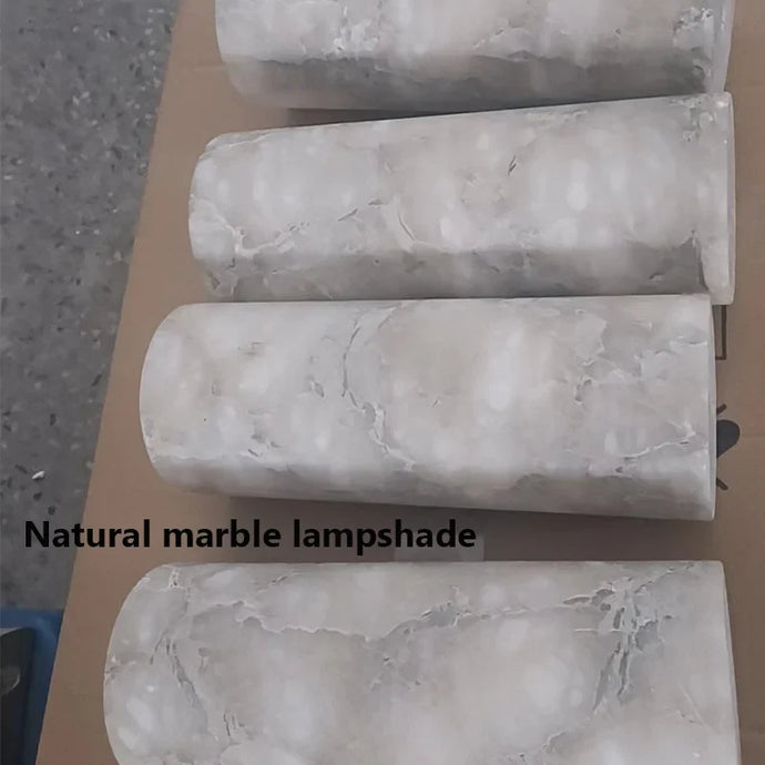 "Luxurious marble wall decor with ambient lighting; features elegant stone pattern, perfect for modern home interiors."