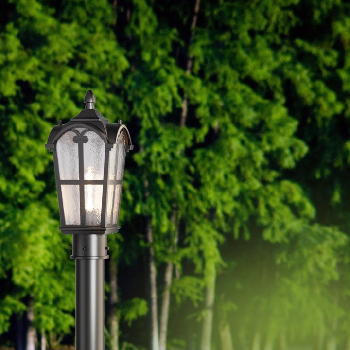 Matt black outdoor post light with clear glass shade, elegant design, perfect for gardens, pathways, or entryways.