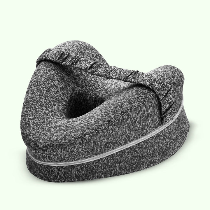 "Memory foam leg and knee support pillow in grey, pink, and white for pain relief, shown in various color options."