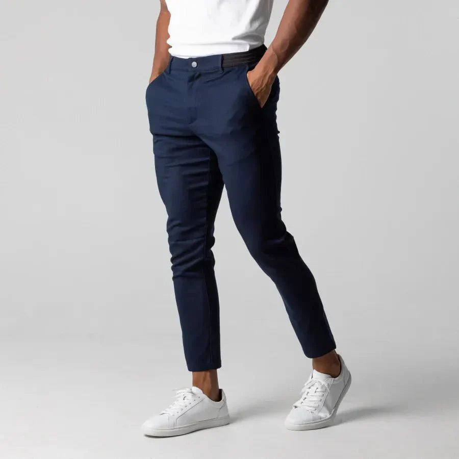 Men's modern tapered chino pants in neutral tones, front view showcasing a stylish, streamlined fit with functional pockets.