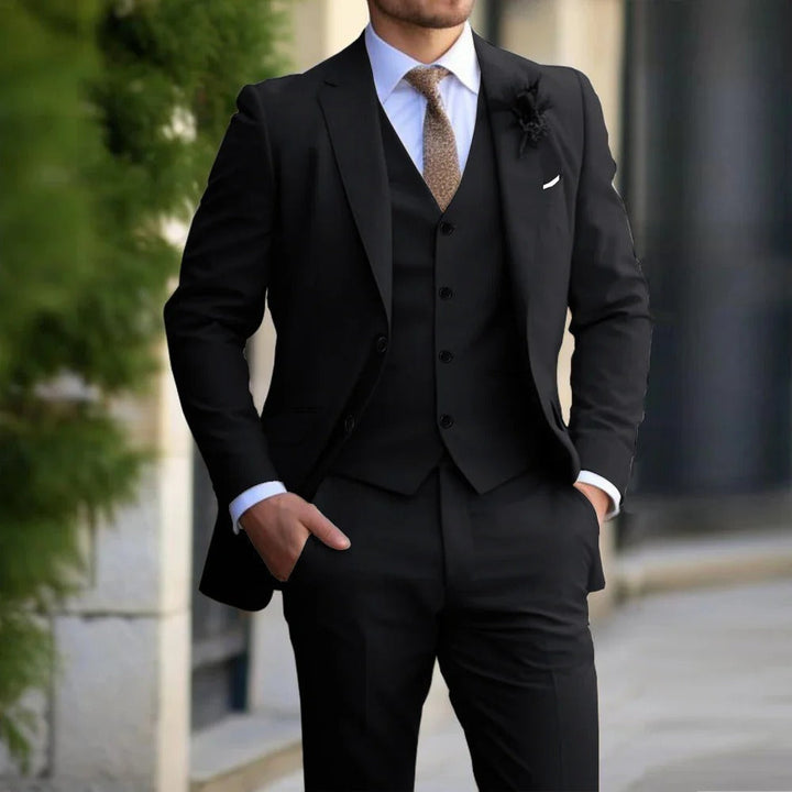 "Men's slim fit 3-piece suit in beige on mannequin; sleek blazer, vest, trousers; perfect for formal events; versatile attire