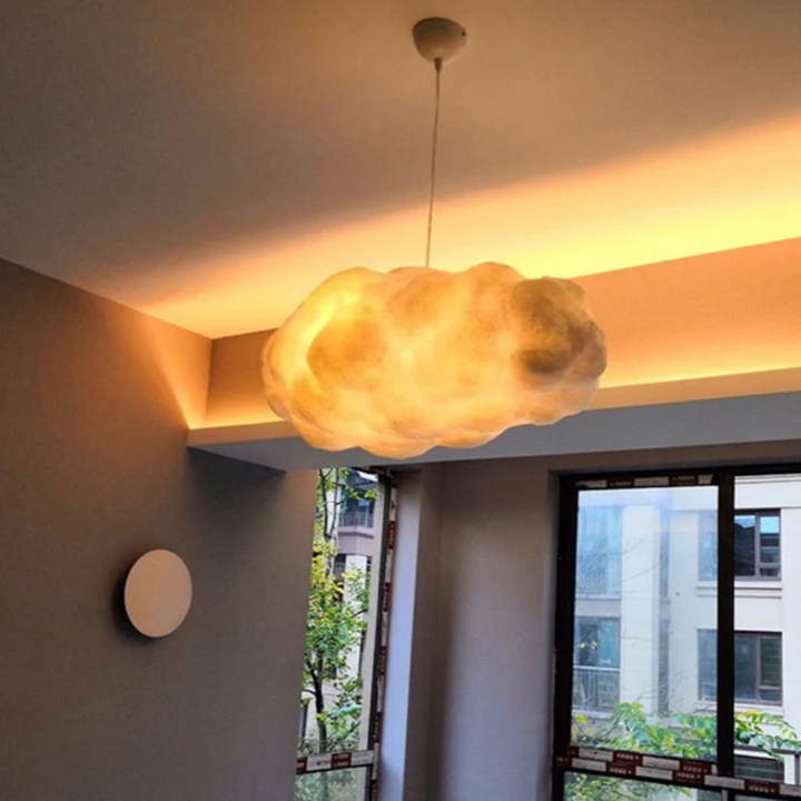 "Modern LED pendant light with cloud-like design, made of PVC and cotton, ideal for interiors. Nimbus style for cozy ambiance