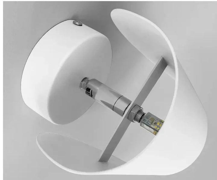 Modern LED up-down wall sconce light in black and white with minimalist design, perfect for indoor ambient lighting.