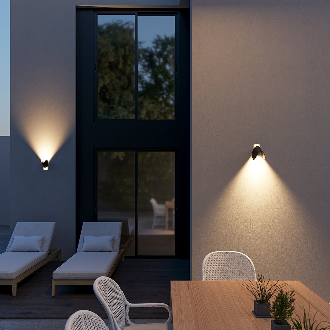 Modern LED up-down wall sconce light in black and white with minimalist design, perfect for indoor ambient lighting.