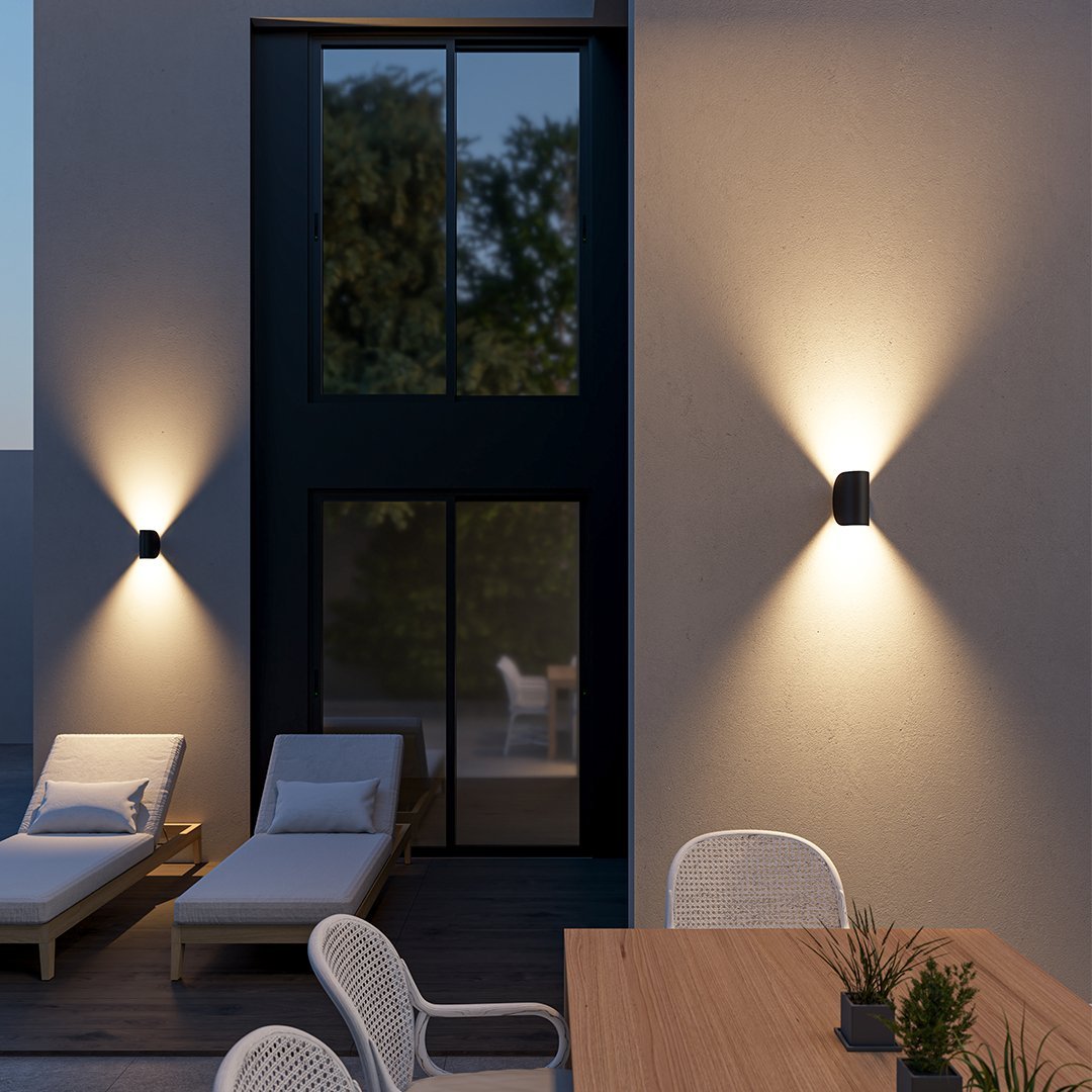 Modern LED up-down wall sconce light in black and white with minimalist design, perfect for indoor ambient lighting.