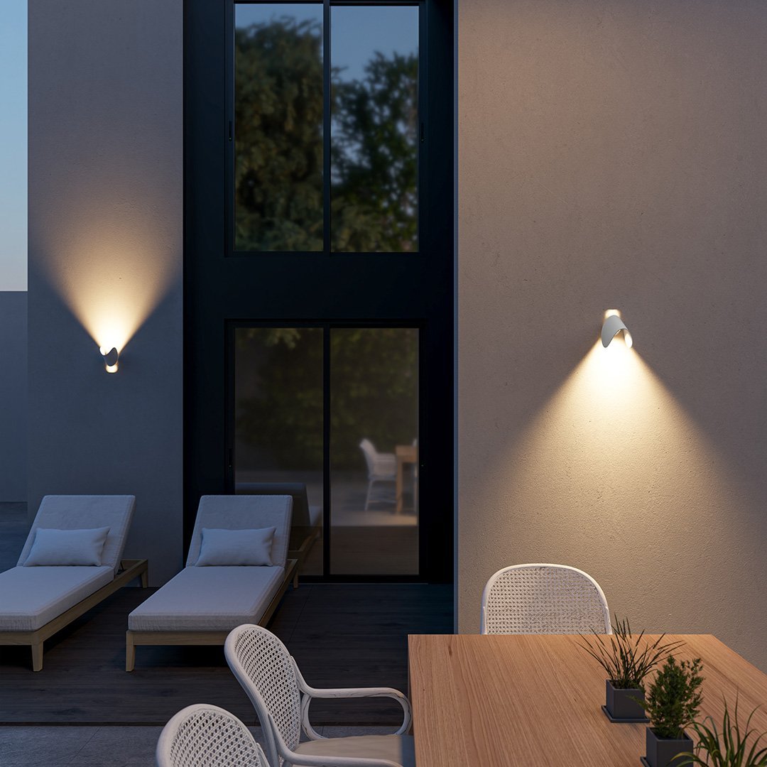 Modern LED up-down wall sconce light in black and white with minimalist design, perfect for indoor ambient lighting.