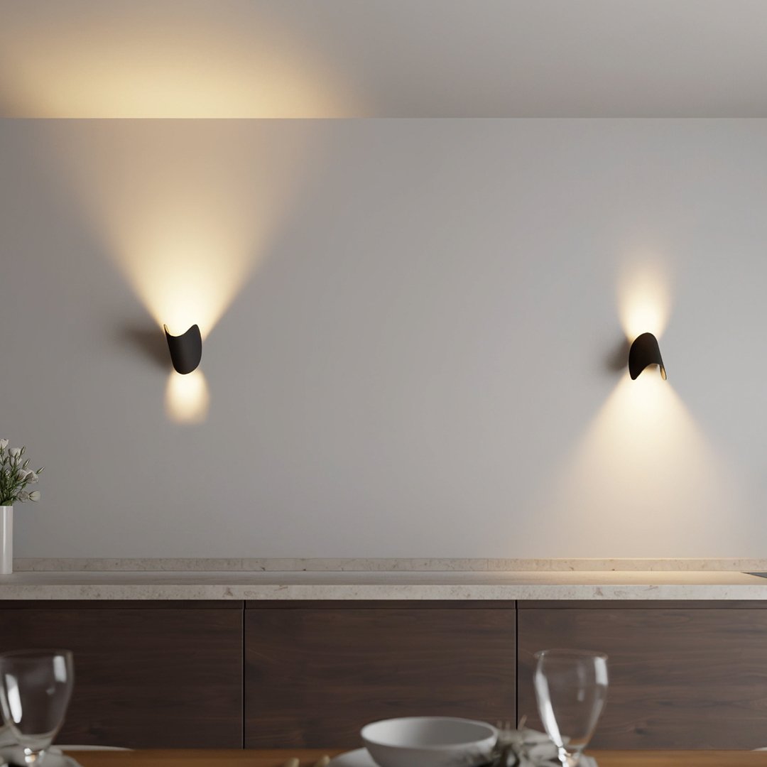 Modern LED up-down wall sconce light in black and white with minimalist design, perfect for indoor ambient lighting.
