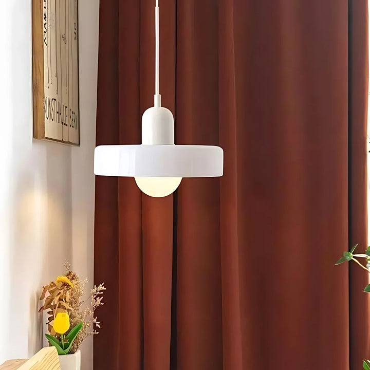 "Modern glass pendant light with sleek glass, brushed metal, ideal for elegant interiors, adds sophistication and warmth."