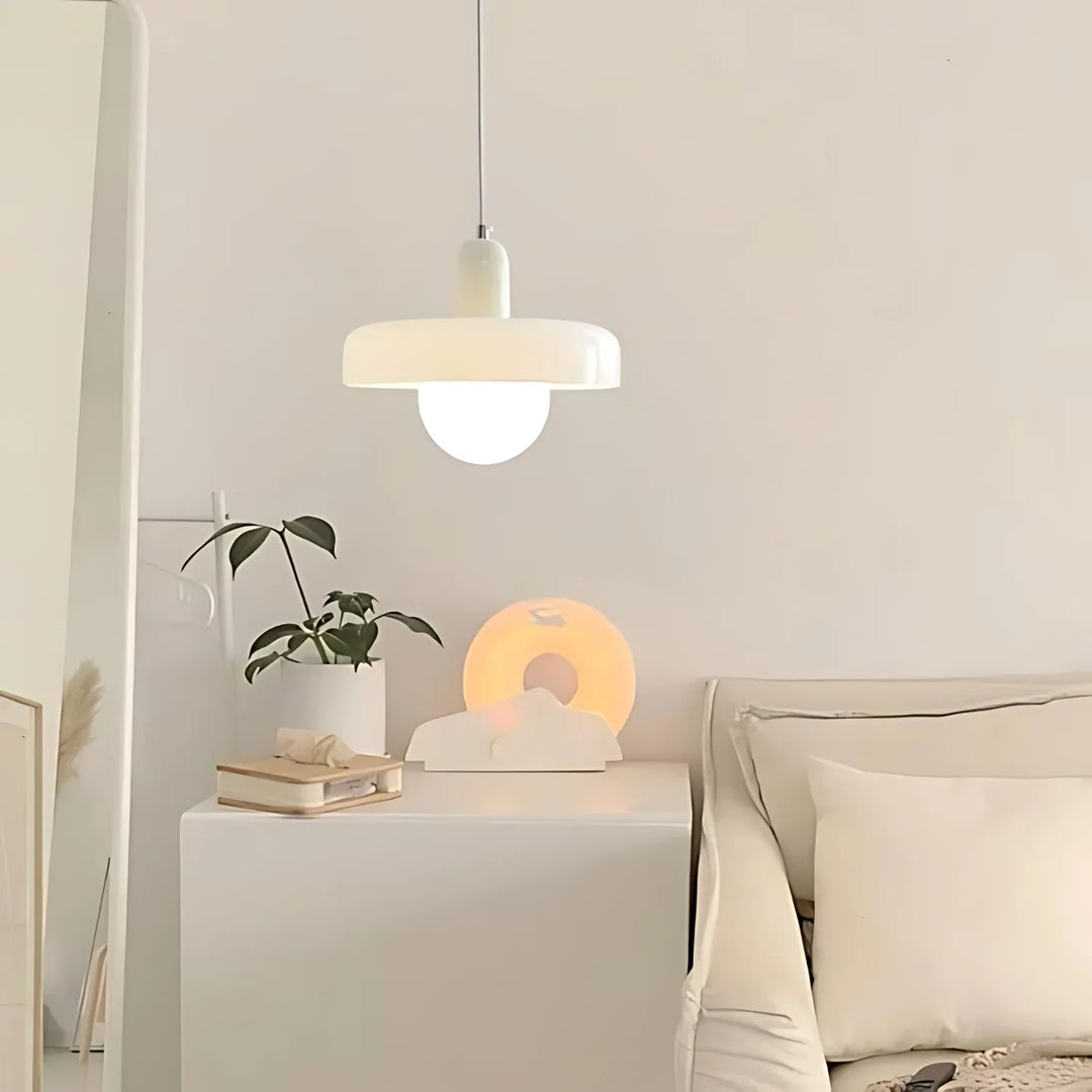 "Modern glass pendant light with sleek glass, brushed metal, ideal for elegant interiors, adds sophistication and warmth."