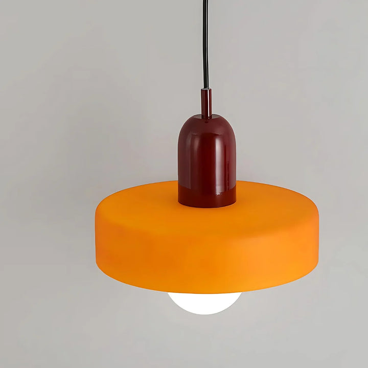 "Modern glass pendant light with sleek glass, brushed metal, ideal for elegant interiors, adds sophistication and warmth."