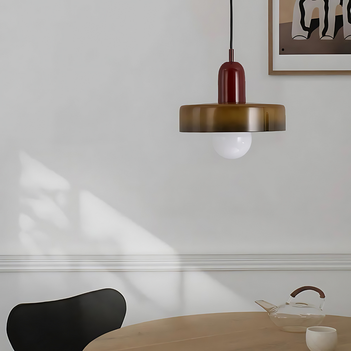 "Modern glass pendant light with sleek glass, brushed metal, ideal for elegant interiors, adds sophistication and warmth."