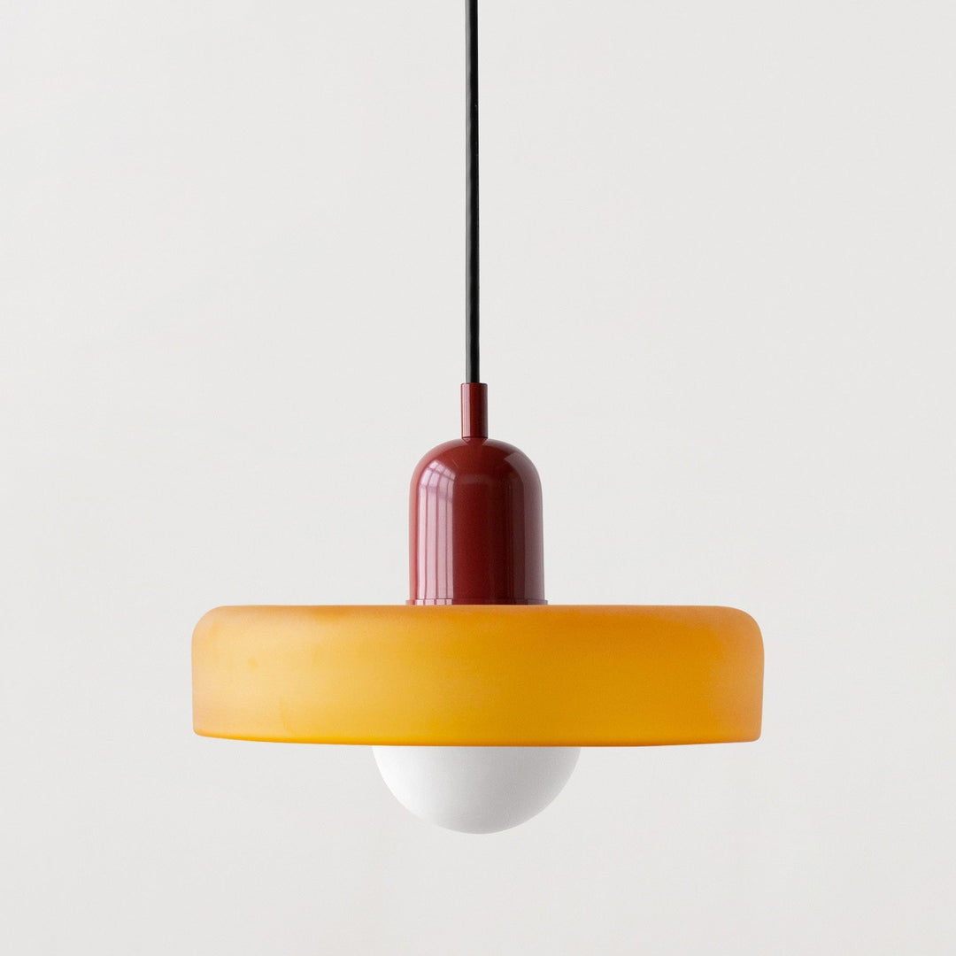"Modern glass pendant light with sleek glass, brushed metal, ideal for elegant interiors, adds sophistication and warmth."