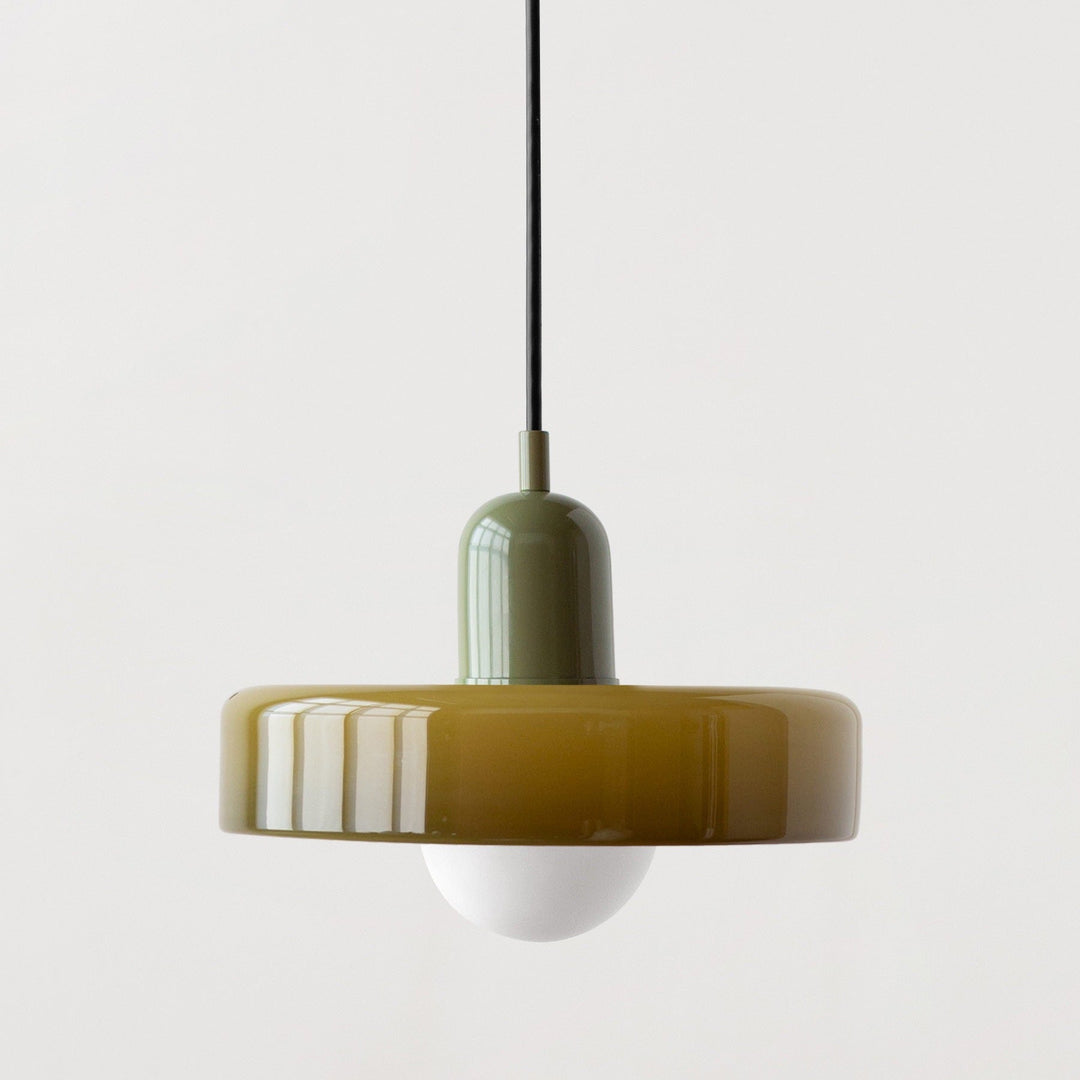 "Modern glass pendant light with sleek glass, brushed metal, ideal for elegant interiors, adds sophistication and warmth."