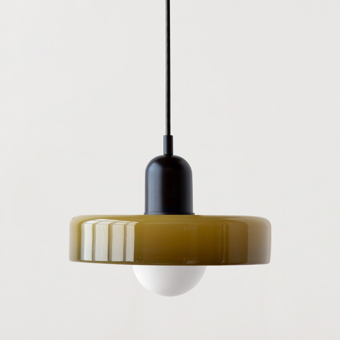 "Modern glass pendant light with sleek glass, brushed metal, ideal for elegant interiors, adds sophistication and warmth."