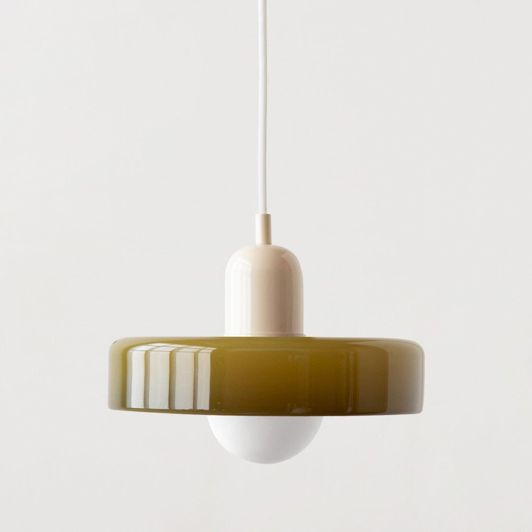 "Modern glass pendant light with sleek glass, brushed metal, ideal for elegant interiors, adds sophistication and warmth."