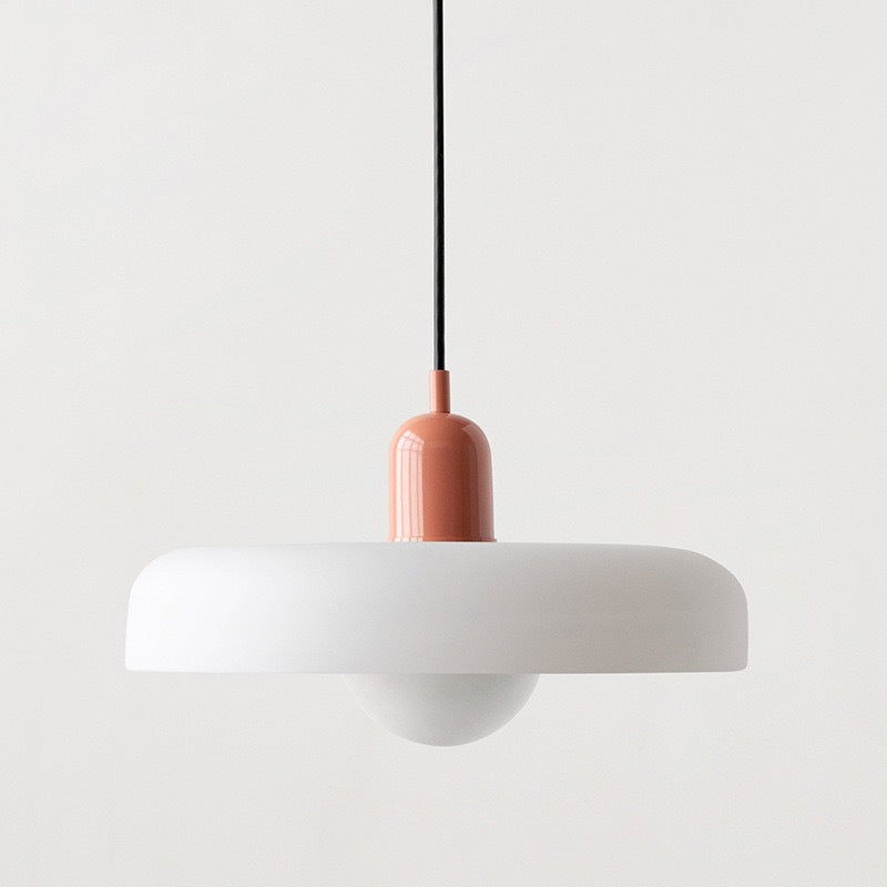 "Modern glass pendant light with sleek glass, brushed metal, ideal for elegant interiors, adds sophistication and warmth."