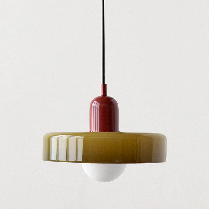 "Modern glass pendant light with sleek glass, brushed metal, ideal for elegant interiors, adds sophistication and warmth."