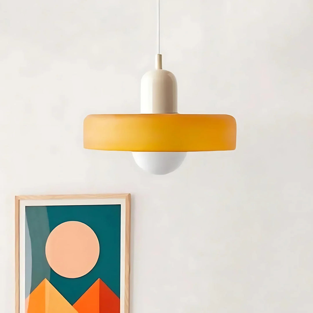 "Modern glass pendant light with sleek glass, brushed metal, ideal for elegant interiors, adds sophistication and warmth."