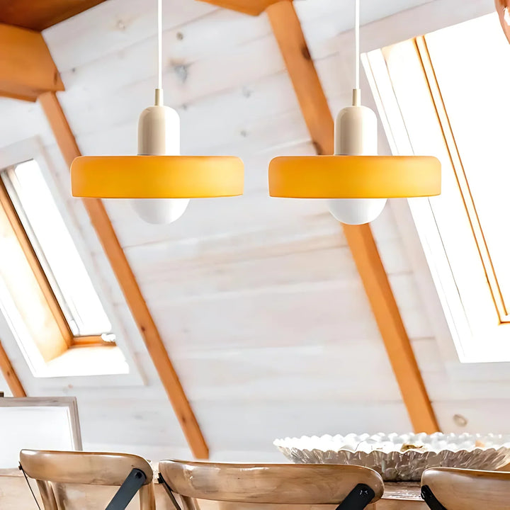 "Modern glass pendant light with sleek glass, brushed metal, ideal for elegant interiors, adds sophistication and warmth."
