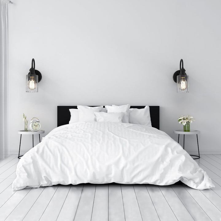 Modern glass wall light with metal frame, glass shade; E27 bulb holder; side profile; elegant design for interior spaces.