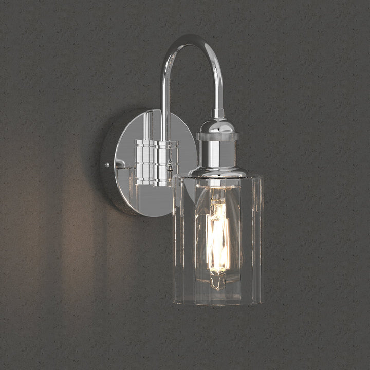Modern glass wall light with metal frame, glass shade; E27 bulb holder; side profile; elegant design for interior spaces.