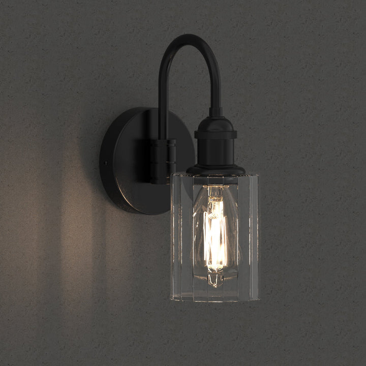 Modern glass wall light with metal frame, glass shade; E27 bulb holder; side profile; elegant design for interior spaces.