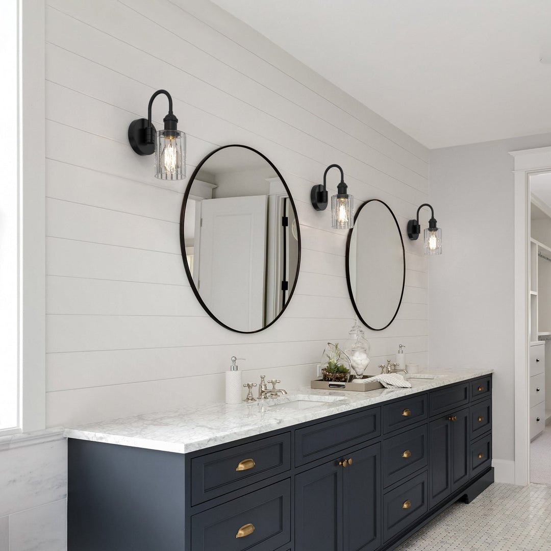 Modern glass wall light with metal frame, glass shade; E27 bulb holder; side profile; elegant design for interior spaces.