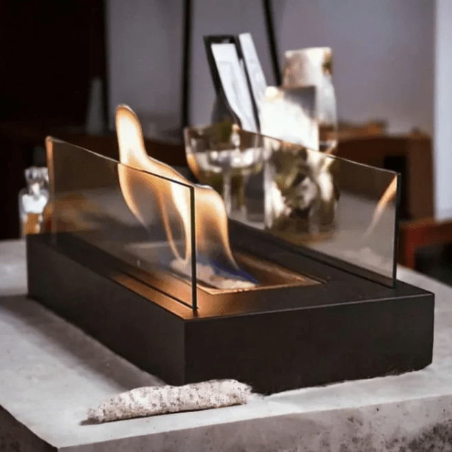 "Modern portable rectangular tabletop fire pit with real flame, sleek black design, tempered glass, and stainless steel body.