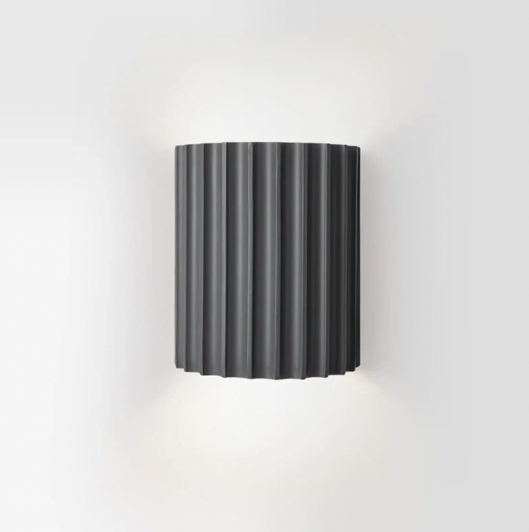 Modern resin wall lamp with artistic design, soft LED lighting, in white, green, grey, or orange for stylish home decor.
