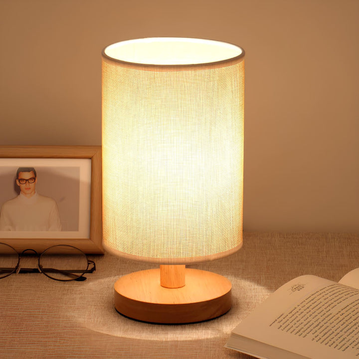 "Modern wooden bedside table lamp with remote, dimmable LED, natural wood look, elegant design for bedroom or living room."