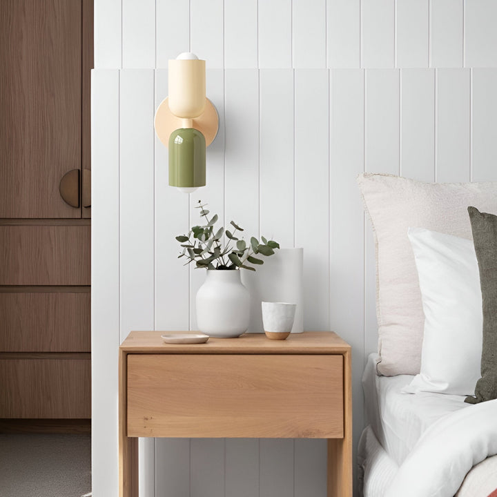 Nordic colourful double head wall light in vibrant colors, painted iron, sleek cylindrical design, casts light up and down.