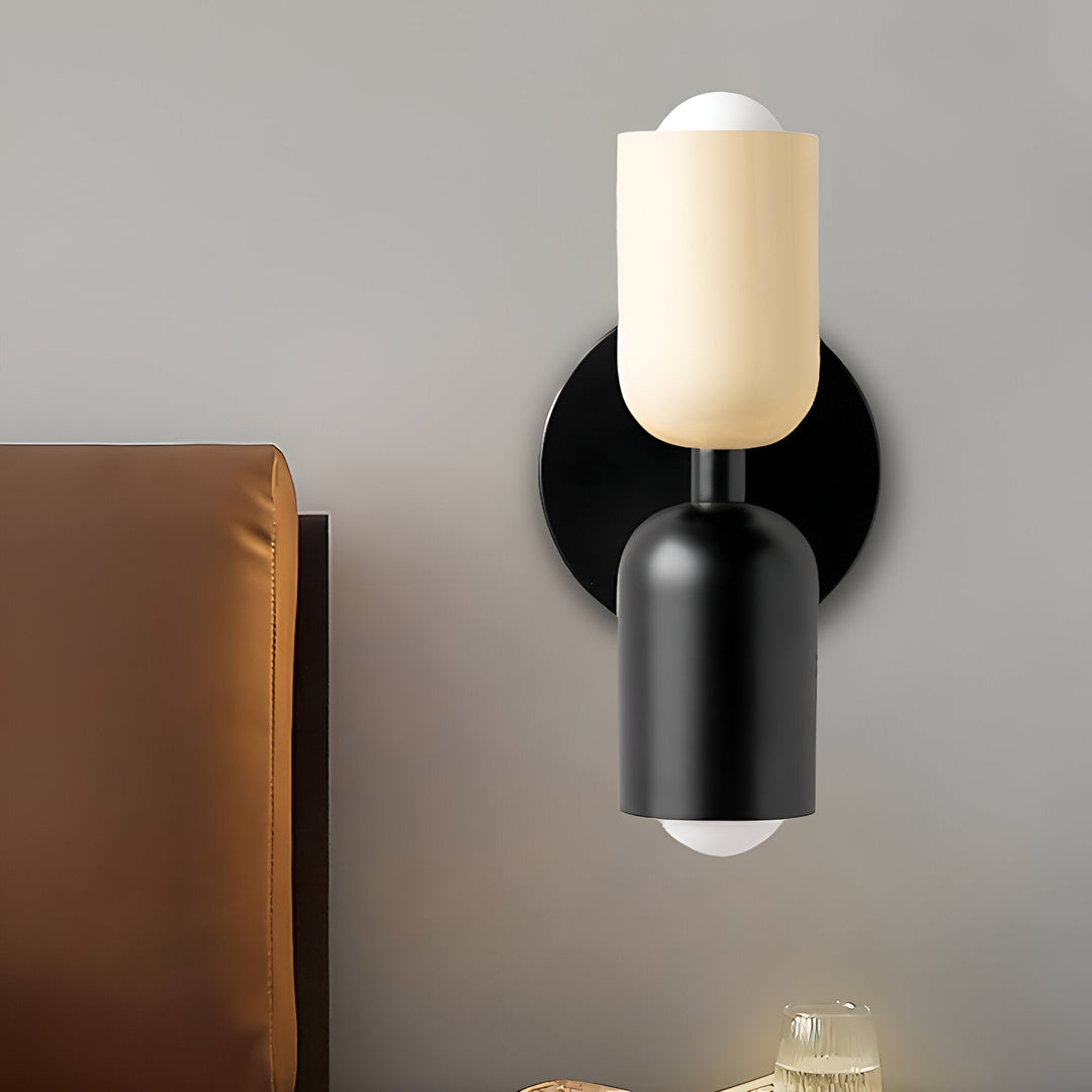 Nordic colourful double head wall light in vibrant colors, painted iron, sleek cylindrical design, casts light up and down.