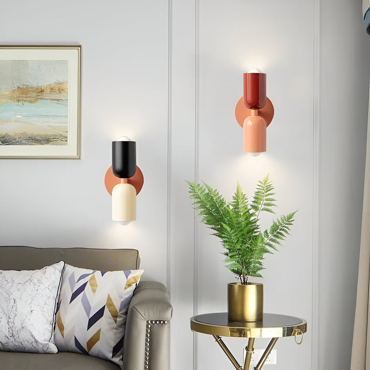 Nordic colourful double head wall light in vibrant colors, painted iron, sleek cylindrical design, casts light up and down.