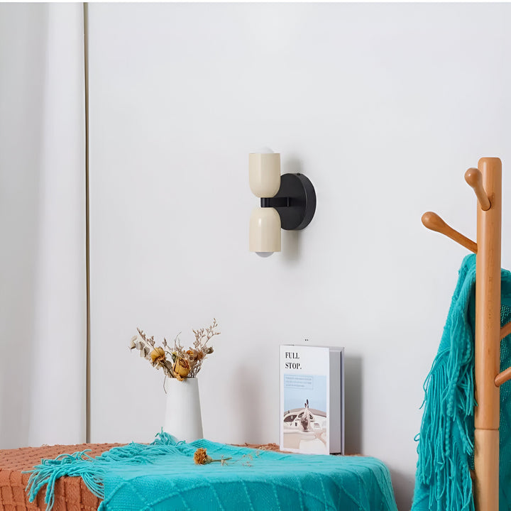 Nordic colourful double head wall light in vibrant colors, painted iron, sleek cylindrical design, casts light up and down.