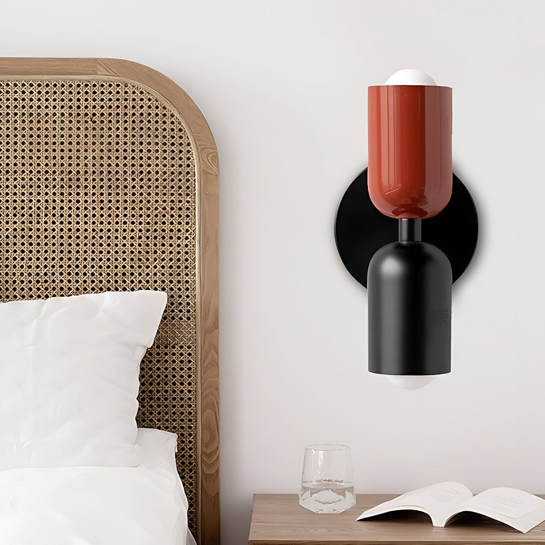 Nordic colourful double head wall light in vibrant colors, painted iron, sleek cylindrical design, casts light up and down.