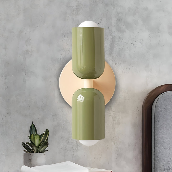 Nordic colourful double head wall light in vibrant colors, painted iron, sleek cylindrical design, casts light up and down.