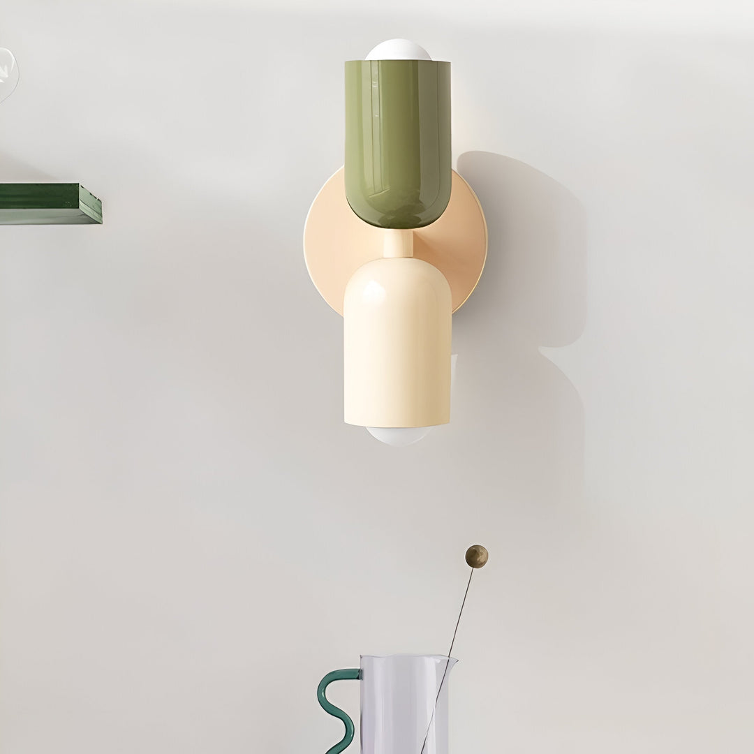 Nordic colourful double head wall light in vibrant colors, painted iron, sleek cylindrical design, casts light up and down.