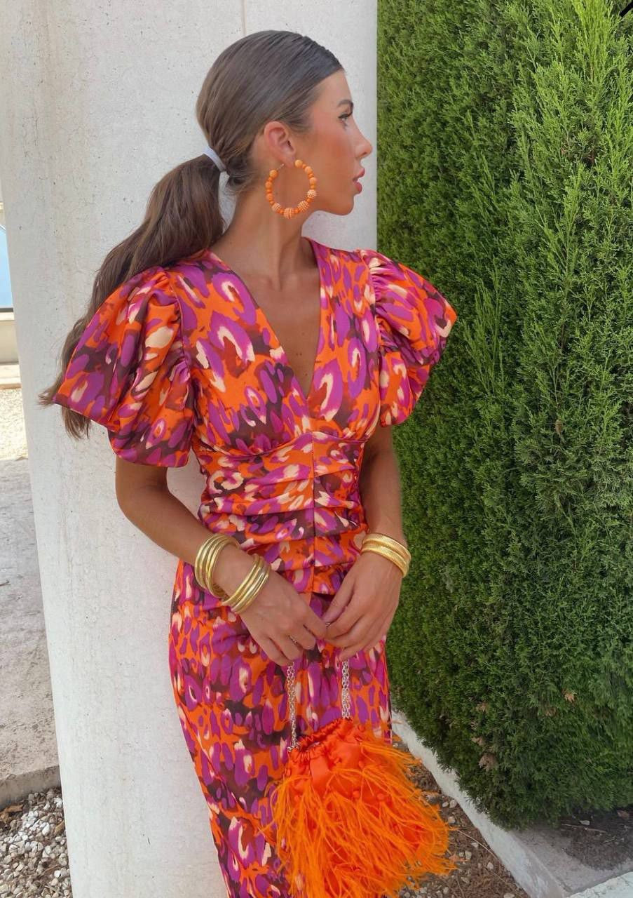 Orange, pink, and purple V-neck bodycon dress, front view, women's elegant silhouette, soft fabric. Perfect for any occasion.