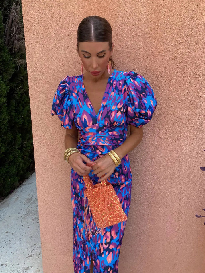 Orange, pink, and purple V-neck bodycon dress, front view, women's elegant silhouette, soft fabric. Perfect for any occasion.