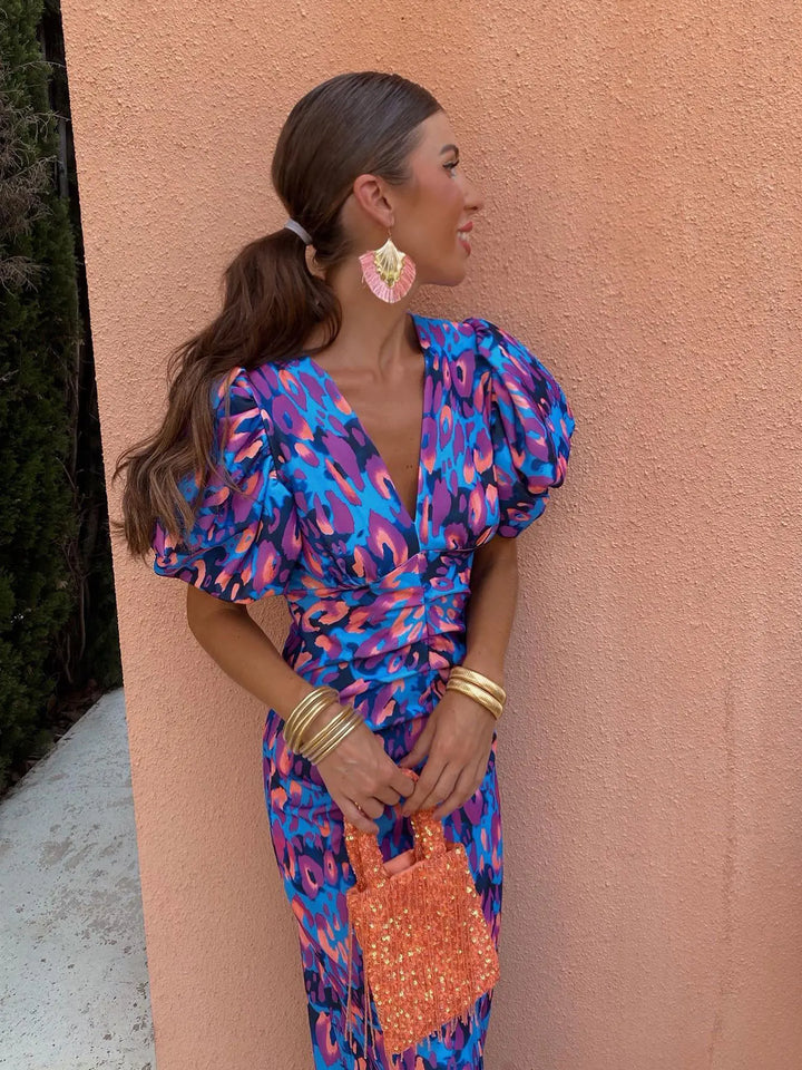 Orange, pink, and purple V-neck bodycon dress, front view, women's elegant silhouette, soft fabric. Perfect for any occasion.