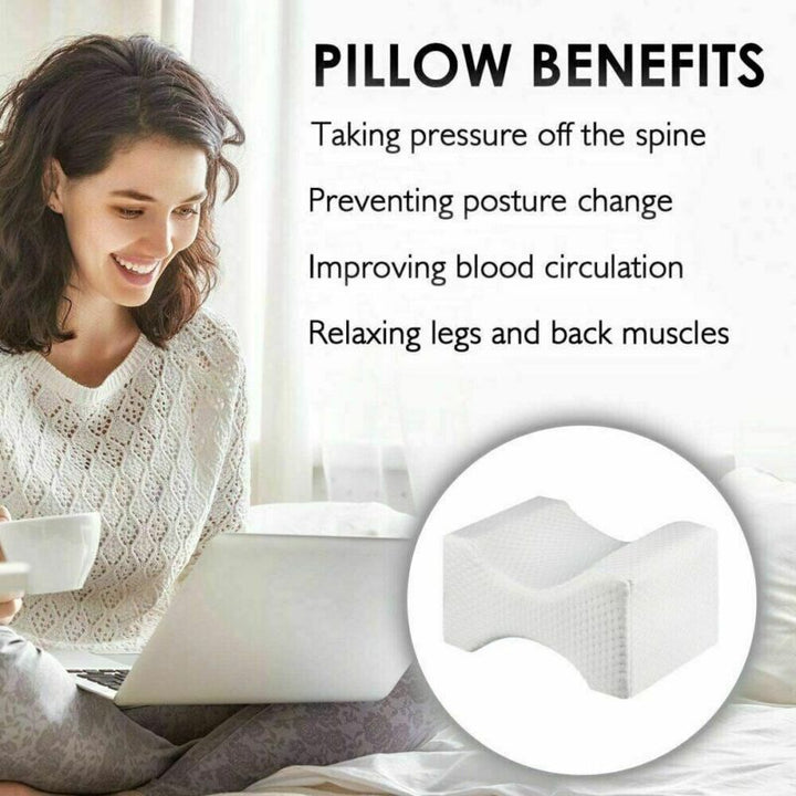 Orthopaedic cushion, white memory foam, ergonomically contoured for hip, knee, and back pain relief, size 24x21x14.5 cm.