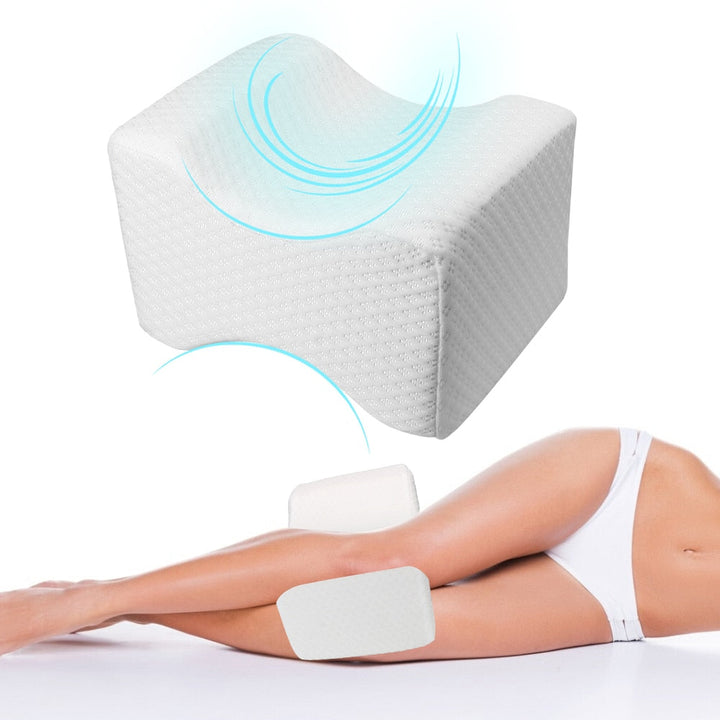 Orthopaedic cushion, white memory foam, ergonomically contoured for hip, knee, and back pain relief, size 24x21x14.5 cm.