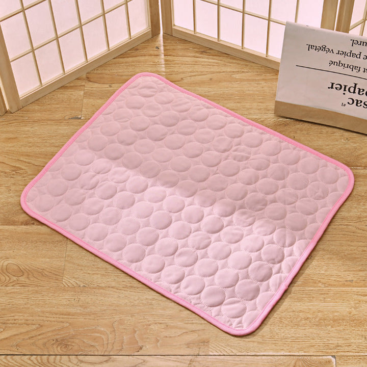Pet cooling mat in calming colors, offers instant cooling relief with soft padding for pets indoors and outdoors.
