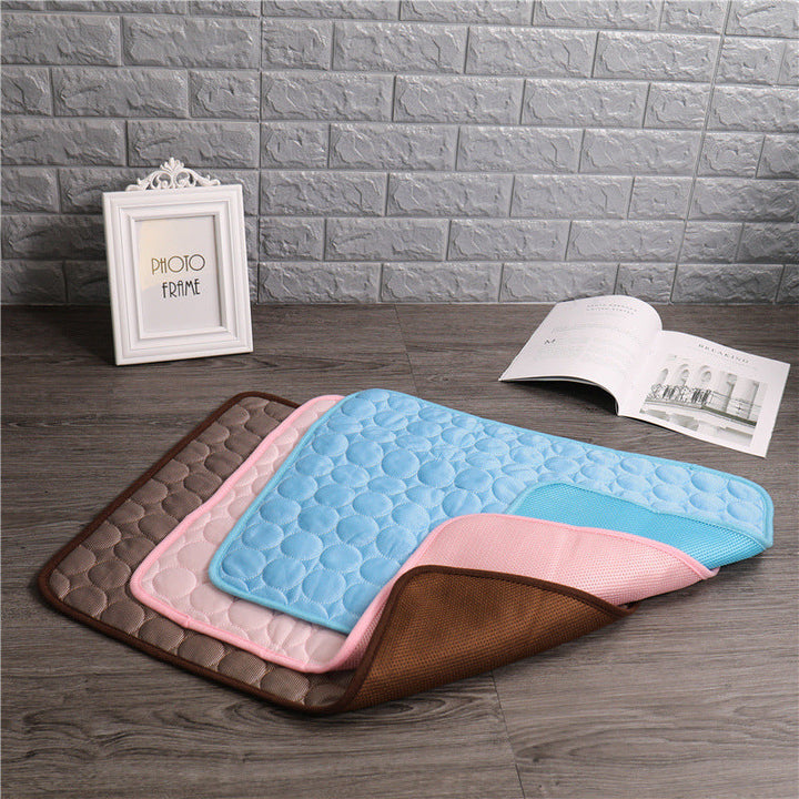 Pet cooling mat in calming colors, offers instant cooling relief with soft padding for pets indoors and outdoors.