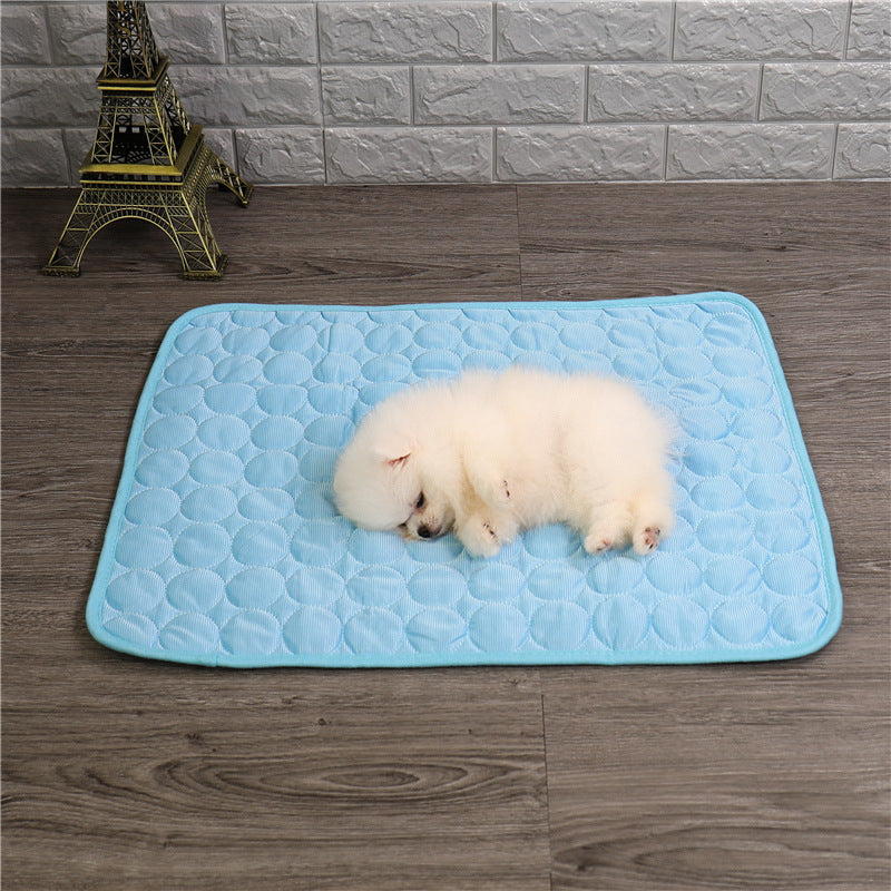 Pet cooling mat in calming colors, offers instant cooling relief with soft padding for pets indoors and outdoors.