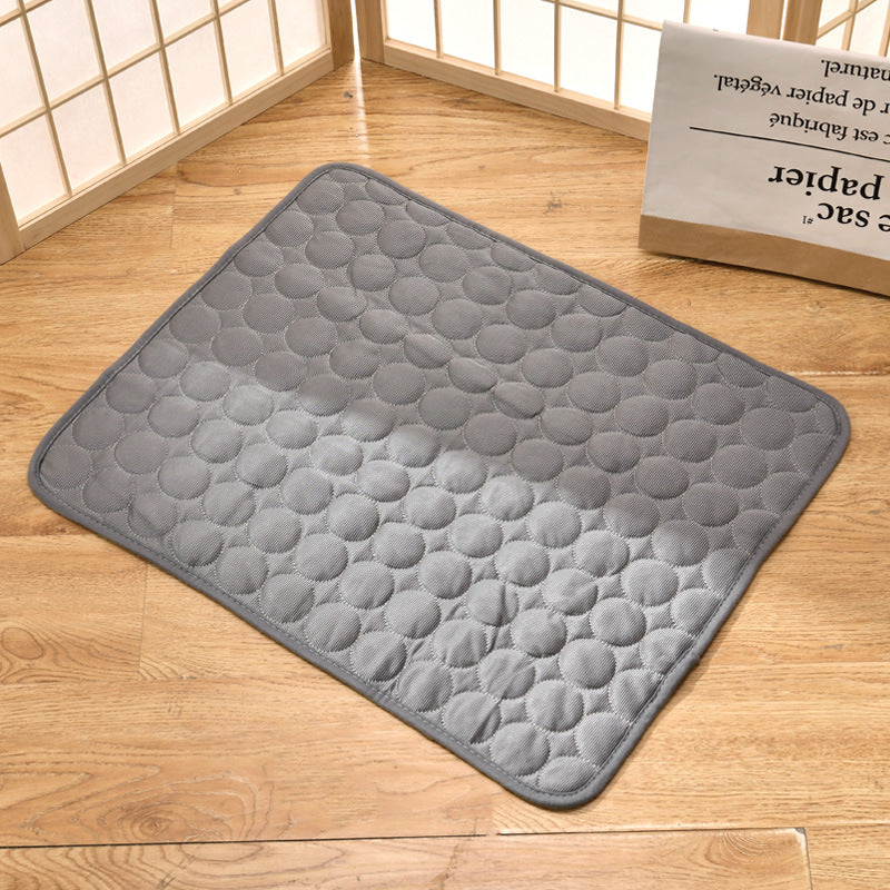 Pet cooling mat in calming colors, offers instant cooling relief with soft padding for pets indoors and outdoors.