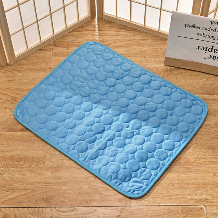 Pet cooling mat in calming colors, offers instant cooling relief with soft padding for pets indoors and outdoors.