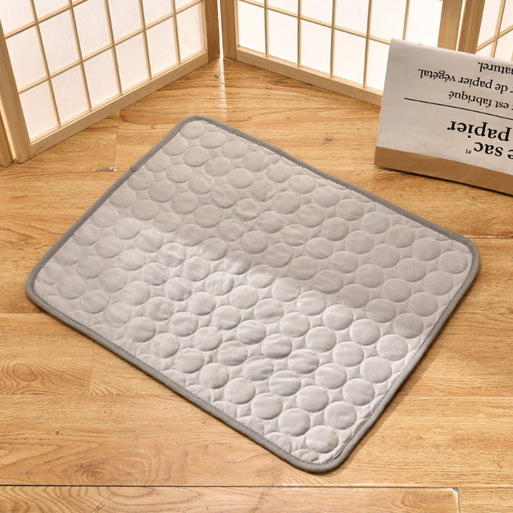 Pet cooling mat in calming colors, offers instant cooling relief with soft padding for pets indoors and outdoors.