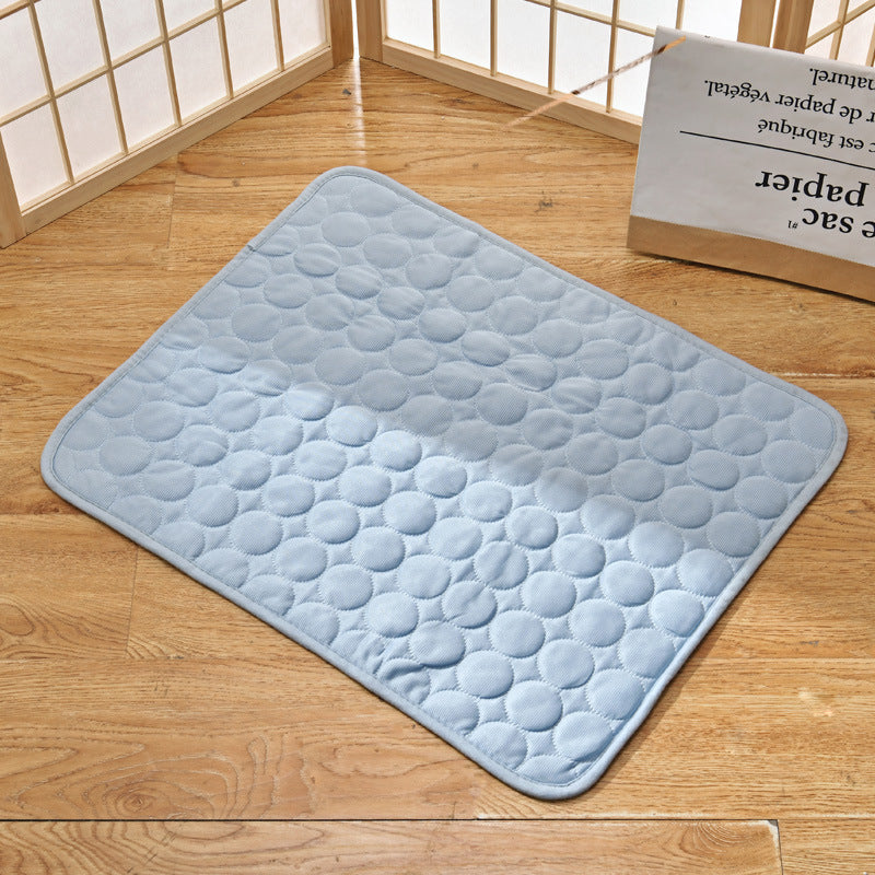 Pet cooling mat in calming colors, offers instant cooling relief with soft padding for pets indoors and outdoors.